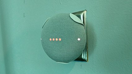 A Google Home Mini, used to play music.  There were a number of these throughout the space, which functioned as a de facto PA system.  The red lights indicate that the microphone is turned off, meaning that it will not respond to the "OK Google" wake word.