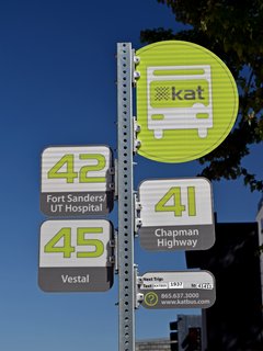 KAT bus stop sign.  I found this interesting because each route has a separate sign attached to the pole.