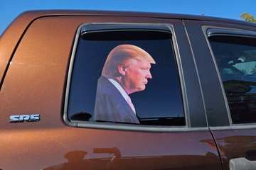 Trump decal on the right rear door of a Toyota Tundra parked at the Harley dealership, as an example of some of the right-wing stuff that we saw.
