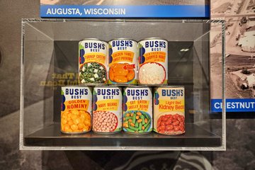 Cans with vintage Bush's labels on display.