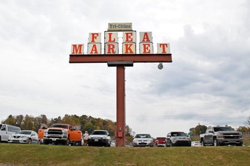 The sign for the Tri-Cities Flea Market, which was a pretty straightforward design, consisting of two steel beams with lettering stacked on top.