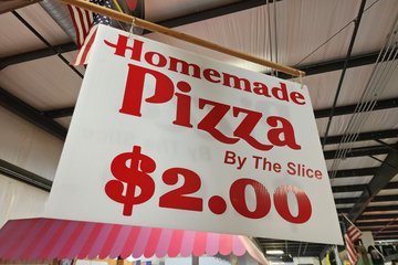 Pizza Hut font being used on a sign at the flea market.  It's not too surprising that someone would do this, because the font is easily downloaded online (it's called "Hot Pizza"), but I never expected to see it in the field nonetheless.