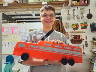 A plastic model of a GMC Scenicruiser, in Greyhound livery.  We bought this with the intention of donating this to Commonwealth Coach and Trolley, which is a bus museum in Roanoke that Elyse and I are both involved with.