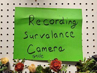 A sign at one booth that advised visitors that security cameras were in use.  I find those signs that say, "Smile, you're on camera," to be a bit obnoxious (vs. a more generic "security camera in use" sign), but this one wasn't even spelled correctly.  Generally speaking, a prerequisite to using surveillance cameras should be to know how to spell it correctly.