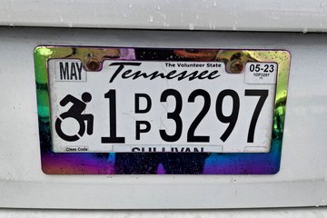 A Tennessee disability license plate.  I was surprised to see the newer wheelchair symbol incorporated into the design.