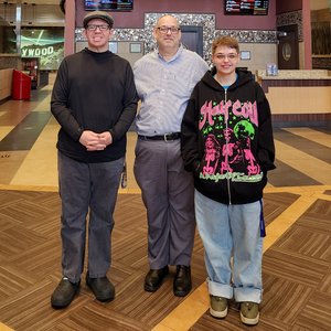 Marc, Elyse, and I pose for a photo in the lobby of Marquee Cinemas.