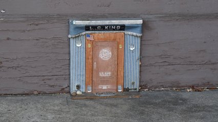 Meanwhile, Elyse took my phone for a moment and got a photo of me photographing this little mouse-sized door.