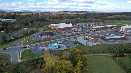 Flying back from the Hampton Inn, with Pal's, Food City, and some other businesses around.