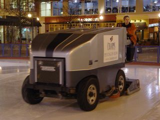 Rheannin, one of the employees at the Pentagon Row ice rink, resurfaces the ice by taking the Zamboni out for a spin.