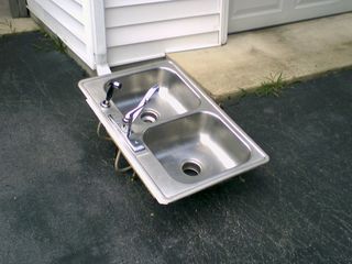 On July 27, while I was in Northern Virginia visiting Matthew Tilley, we finally got the kitchen counters replaced at home. What a strange sight it was to see the old kitchen sink sitting out in the driveway as I was leaving.