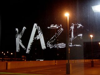 This "KAZE" message was applied to the elevator windscreen using duct tape on the top level of the North Garage at Vienna some time in mid-2006. No idea what it means, though.