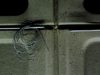 Later on in the day when I was at Pentagon City, the appearance of the sound system has changed. The boxes are gone, and wires are sticking out of the conduit along the wall.