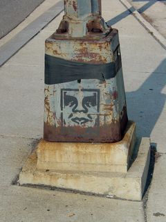 On the way to the Key Bridge, I found this face stenciled on the bottom of a lamppost.