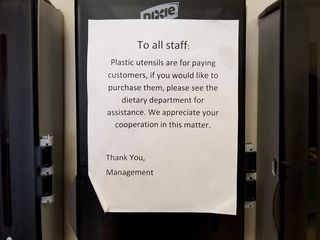 Sign indicating that staff is not allowed to take plastic utensils without making a purchase.  Also a run-on sentence.