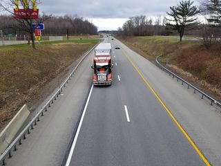 Traffic moving beneath the bridge at the Angola service area.