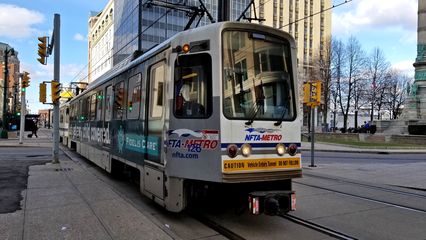 Buffalo Metro Rail vehicle traveling down Main Street.