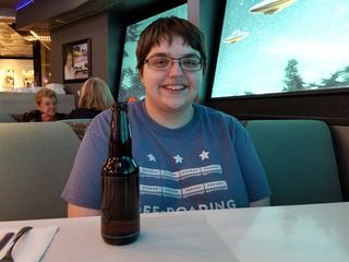 Elyse enjoys a beverage at the Flying Saucer Restaurant.