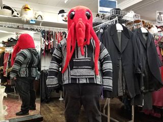 Elyse had me try on a red sea creature head, to much amusement all around.