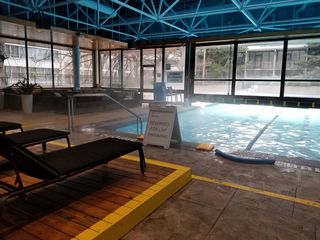 I was surprised to see that the pool was half indoors and half outdoors, and that despite the winter-like temperatures outside, the outdoor portion of the pool was completely open, and one could swim between the indoor and outdoor sections.