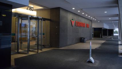 The entrance in more context.  The "Canadian Tire" sign is in between the building's two entrances.