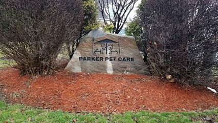 Stone sign for Parker Pet Care in front.