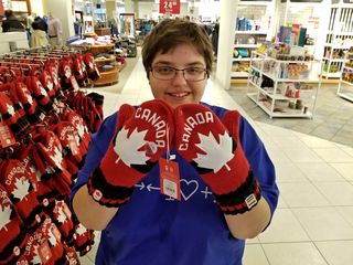 Elyse shows off some Canada-themed mittens at Hudson's Bay.