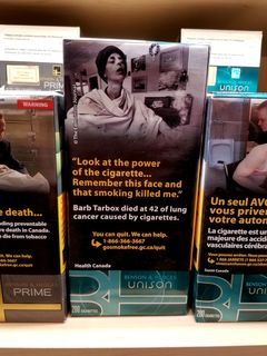 Here's an example on a carton of Benson & Hedges, depicting Barb Tarbox, a lifelong smoker who became a very outspoken anti-smoking activist in her final months before dying of smoking-related health problems.  I have to admit, though, that "Tarbox" is the perfect last name for a smoker.