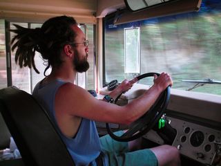 The driver takes the bus up the road to milepost 16, the beginning of our tubing run.