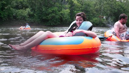 Caitlin is all smiles as we begin our tubing adventure.