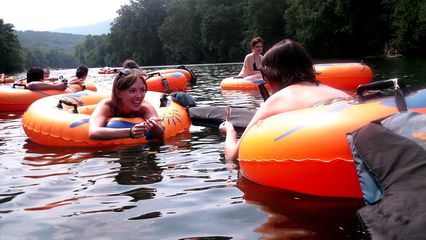 Justine and Erica converse on the river.