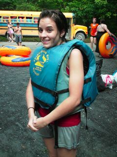 Caitlin got really cold soon after getting out of the river. Here, she uses two life jackets to try to stay warm.