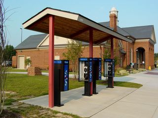 Outside the rest area building, the usual facilities can be found, though with a more updated look to them. Note how the picnic table is not in line with the sidewalk and the canopy - it's at an angle! Also notice the bench - much more ornate, and sporting an outline of Virginia, which actually ended up being a recurring theme here.