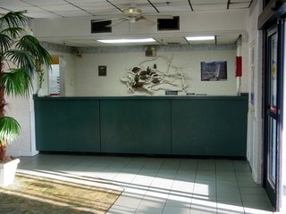 As a side note, this is the front desk of the Ocean Holiday. The fire panel is that red box at right.