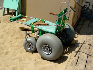 Heading down to the beach, we found what I describe as an all-terrain wheelchair. It's got wheels by Roleez, and is designed for those with disabilities to get around on the beach, since using a conventional wheelchair would be impractical in the sand.