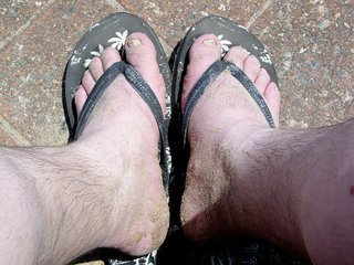 After getting out of the ocean, I headed back to the boardwalk to dry off and clean the sand off. Still, though, look at the sand on my feet. I certainly accumulated my fair share of sand. One of those little outdoor pull-cord showers got that all off. It also got most of the salt water residue off, too, especially since I'd otherwise have to live with that all day. The water, however, was COLD...