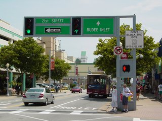 Most of the big intersections along Atlantic Avenue have several of these structures around them. Big and overhead. The "Don't Block the Box" sign is one that is found all over the resort area. What they're saying is not to block the intersection, which they have marked with diagonal lines in both directions. Thus the area is clearly designated. Block it, and you could be fined up to $200.