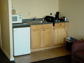 The kitchenette had a coffee maker, a refrigerator, some cabinets, and a microwave. The kitchenette also became the home of Big Mavica, as I kept the camera bag and charger plugged in here. I also kept my cell phone on the charger here, too.