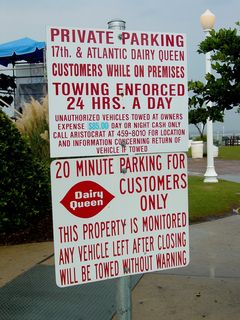 More of those obnoxious parking signs, this one at the Dairy Queen at 17th and Atlantic. And the standard issue sign was apparently not enough, as there's a second threatening sign underneath.