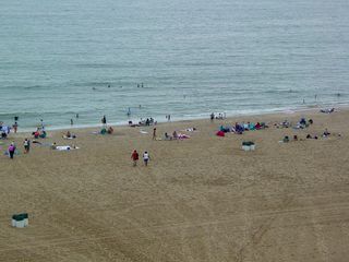 Despite the clouds, wind, and rain, the beach was still well attended.