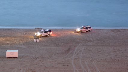 Two vehicles for the Virginia Beach Lifesaving Service were on the beach, but I had no idea what they were doing at this time...