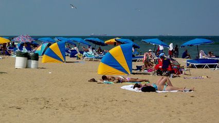 The beach and the ocean were just teeming with people.