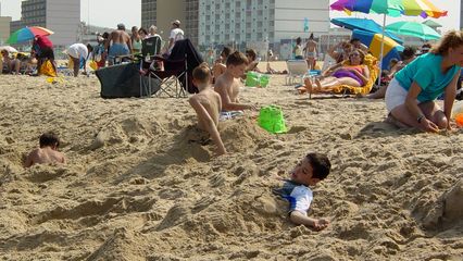 Some people spent time burying each other in the sand as part of their fun in the sun...