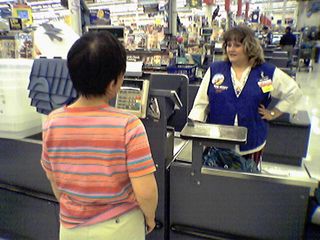 With Rebecca's stuff ready to be scanned, Becky ponders the debit machine.