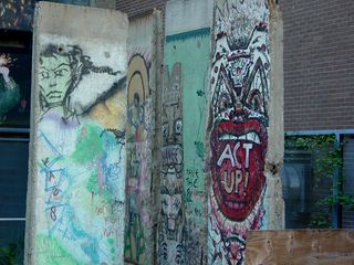 The guard tower was gone, and the pieces of the Berlin Wall were moved out of the way, presumably to facilitate the tower's removal.