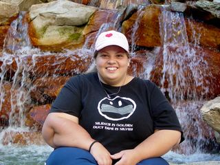 Katie poses in front of the fountain...