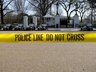 Police tape in front of the White House.