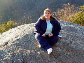 On the day after Thanksgiving, I spent it away from the stores, and out with Katie, where we went up to the Blue Ridge Parkway. Here, Katie poses on a rock at 20-Minute Cliff. 