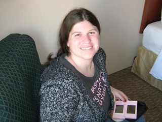 On December 27, with Mom and I having freshly arrived in Chicago that morning, Sis smiled for the camera while we got our junk in order at the hotel.