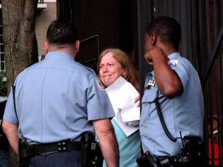 The cops questioned Scientology spokesmodel Sylvia Stanard about the whole affair. I presume that Sylvia is biting her lip in this photo because she's having trouble coming up with a believable lie to tell the police.