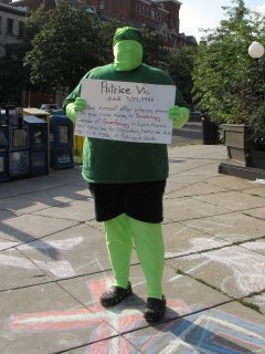 More displaying of the victims-of-Scientology signs. One person taped it to her back, while I posed with a sign.